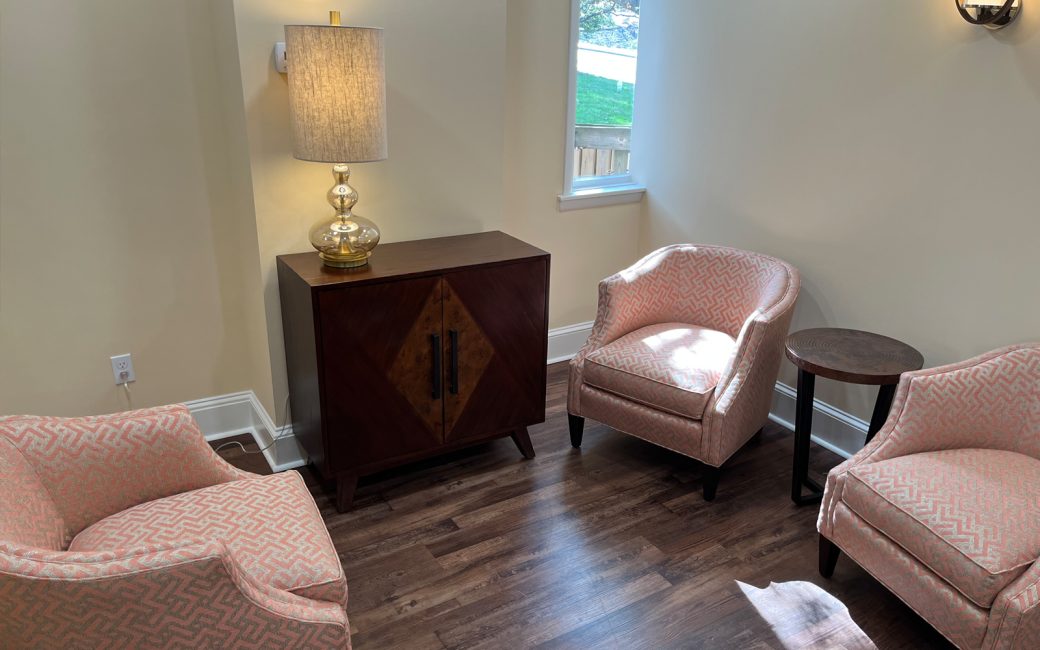 counseling room with pink patterned chairs