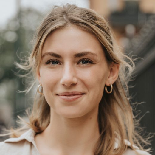 Woman with closed mouth smile