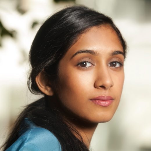 Woman looking over should with neutral expression