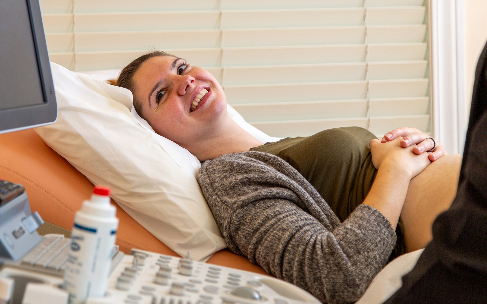 Woman smiling and getting ultrasound