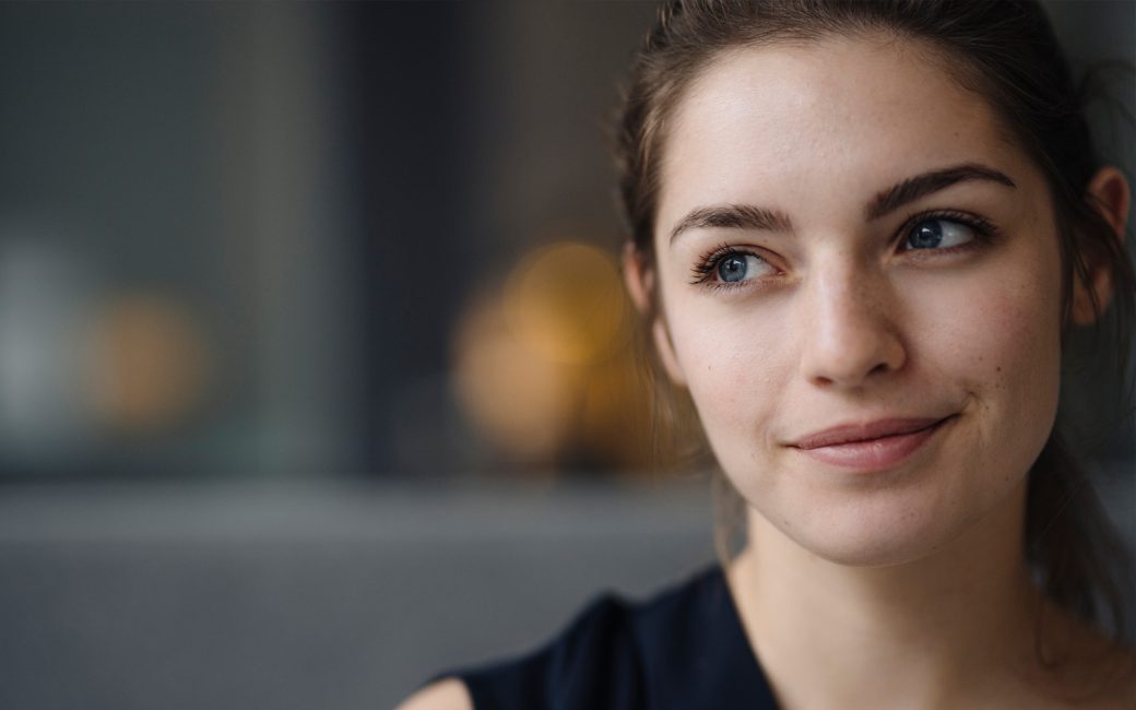 Woman with blue eyes looking off to the left