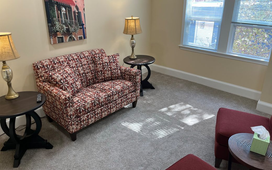 counseling room with pink floral small couch