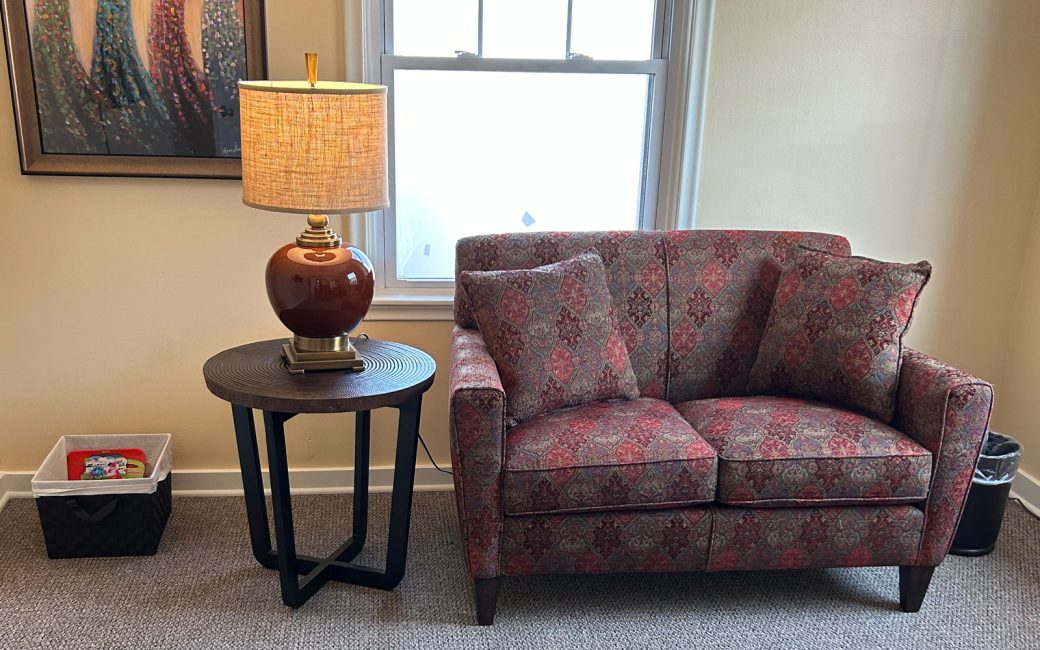 counseling room with small couch and side table