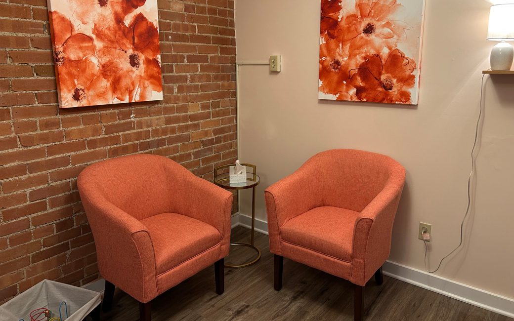 waiting room with orange chairs