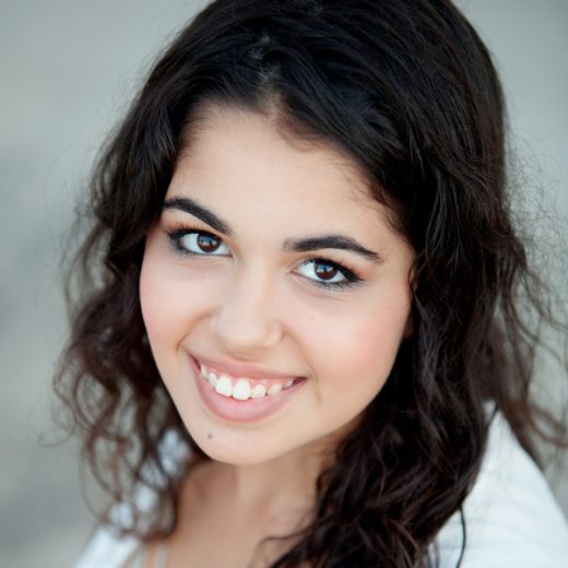 headshot of woman looking up and smiling