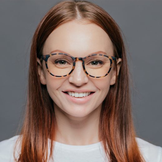 woman with glasses and red straight hair