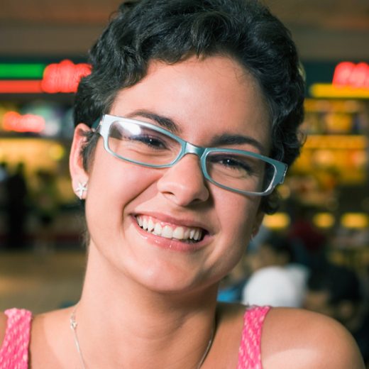 woman with glasses and short black hair