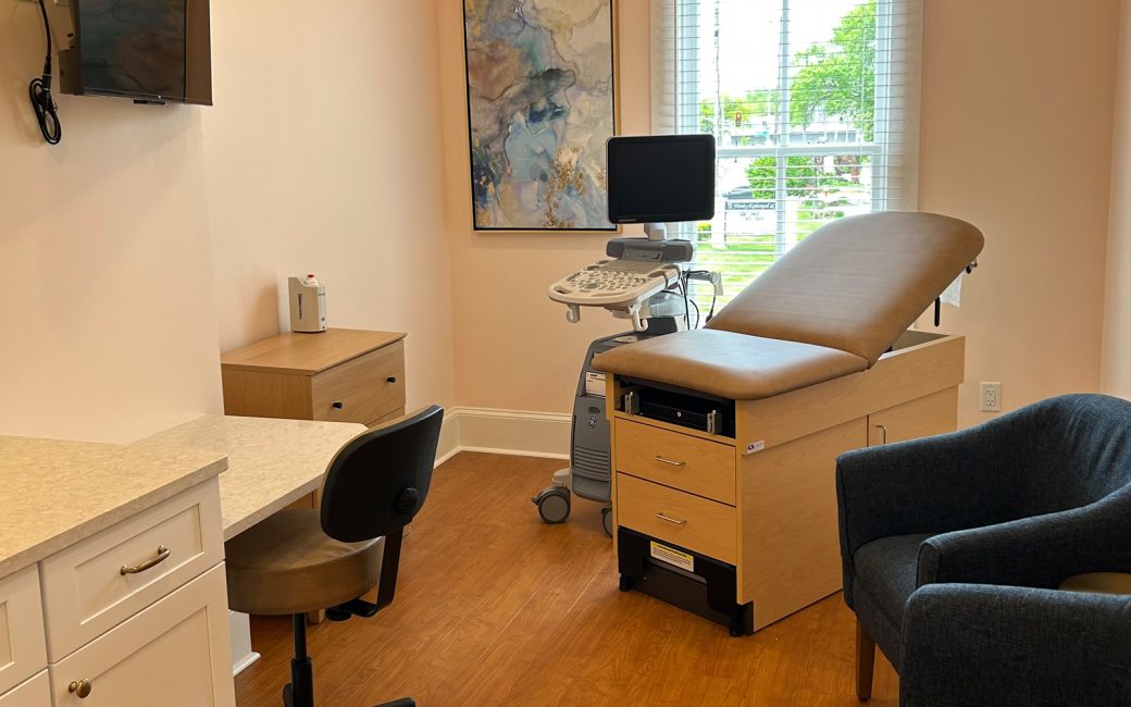 ultrasound room with patient chair and large window