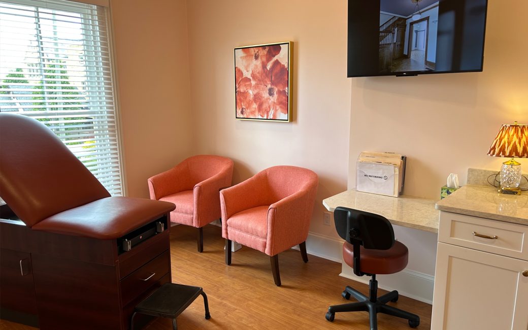 ultrasound room with pink accent chairs