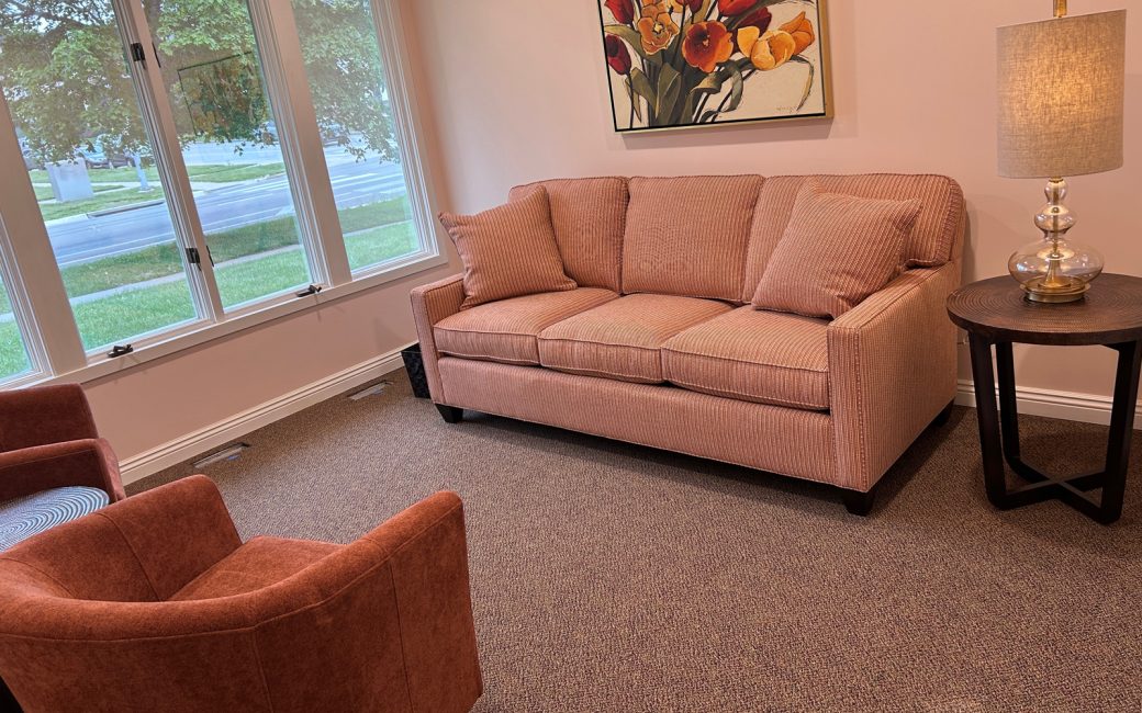private counseling room with pink couch and chair