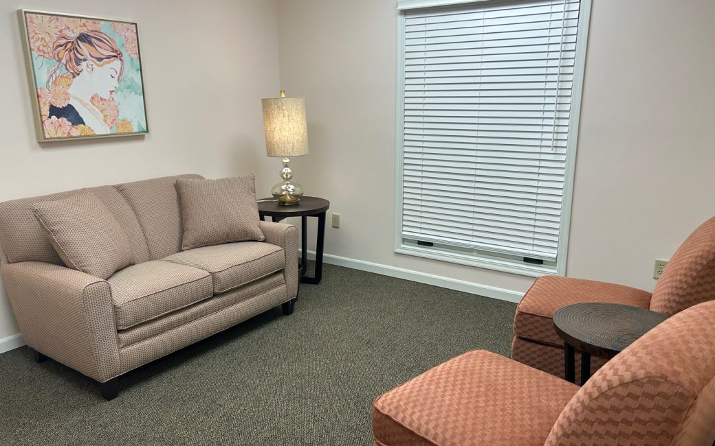 counseling room with tan and orange furniture
