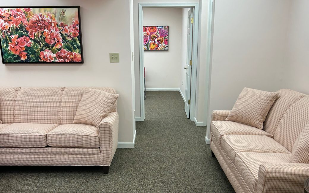 waiting room with couches and hallway